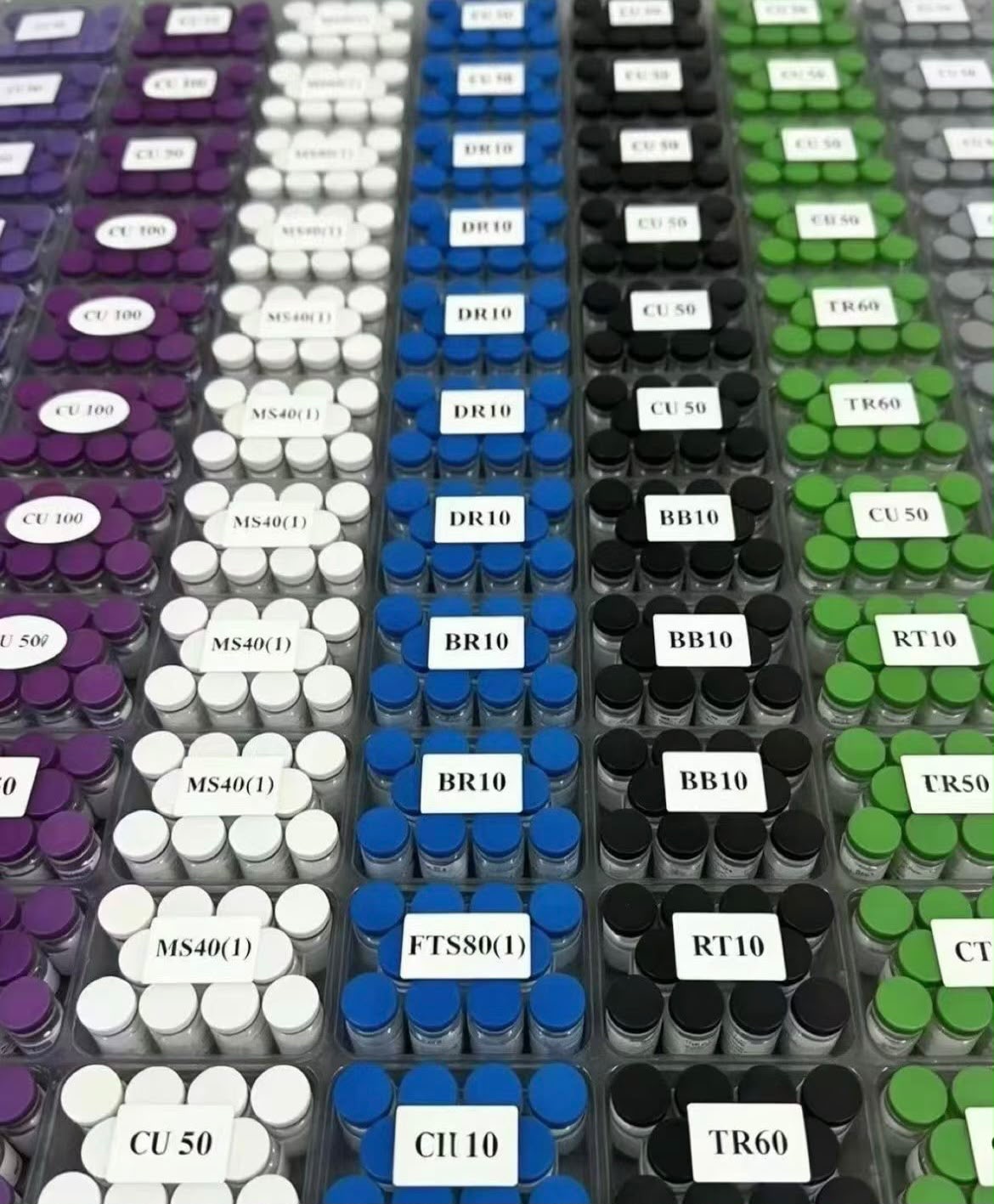 Real peptide stock with visible product labels and color-coded vial trays