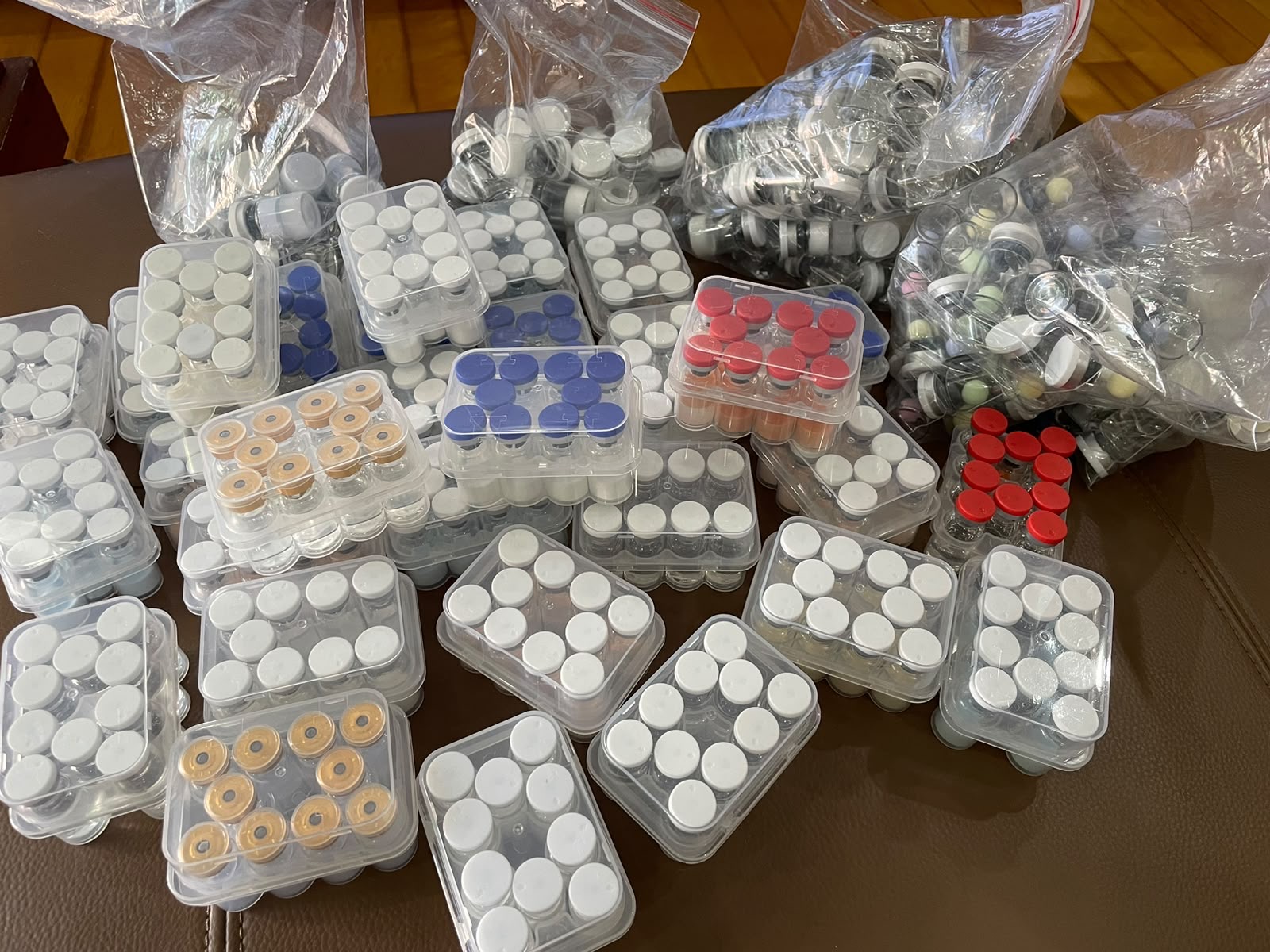 Supplied photograph showing peptide vials in multiple protective trays